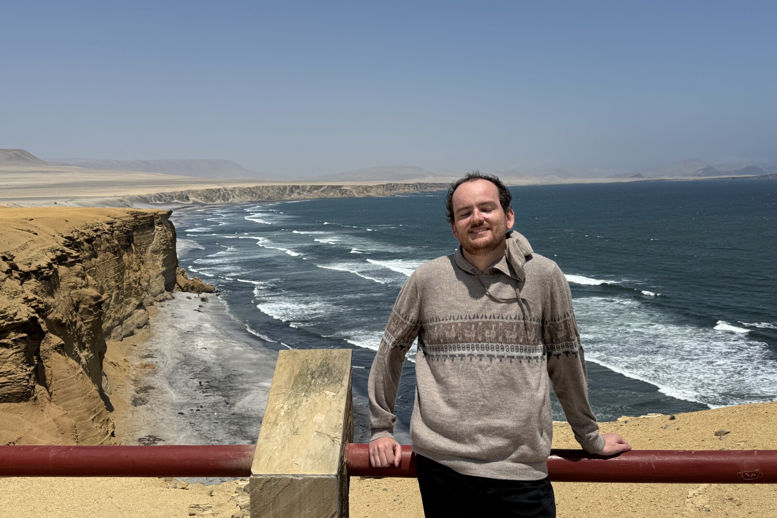 Nathan Mueller smiling at a coastal overlook